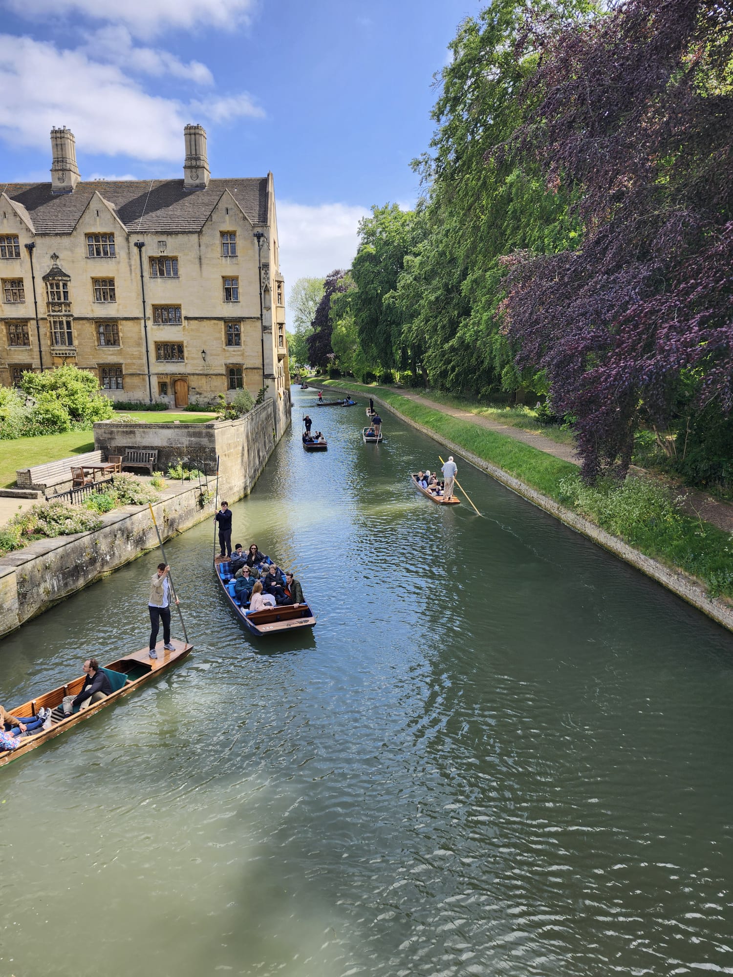 Punting on the River Cam beside a historic Cambridge college.